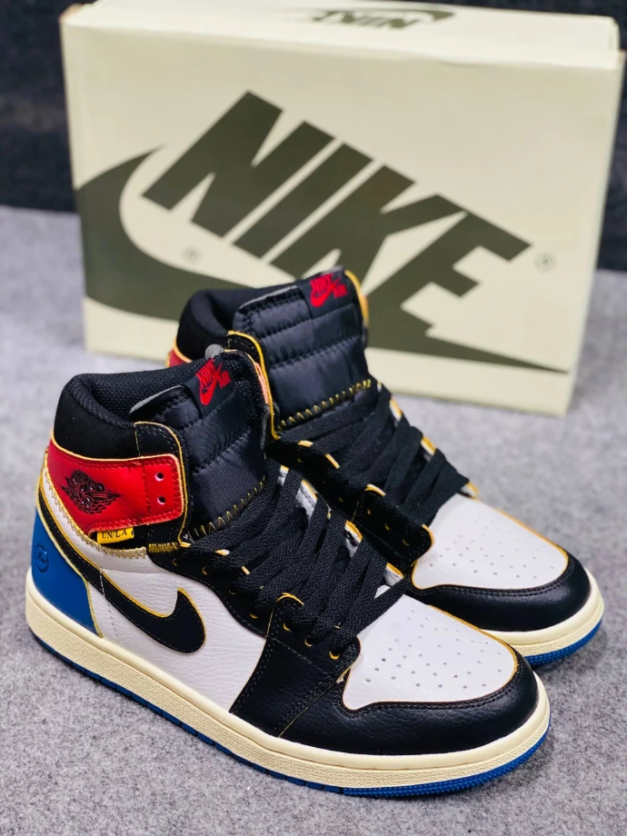 The sneaker in your image is the Union LA x Fragment x Air Jordan 1 High OG "Varsity Red/Sport Royal" 
.